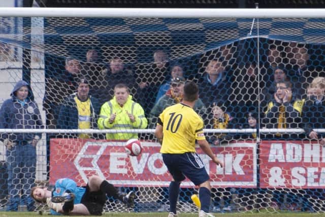 Worksop Town (yellow/blue v Stamford (red)- The Evo-Stik League Premier Division. Leon Mettam (c) penalty goal