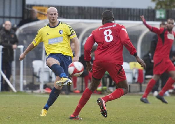 Worksop Town (yellow/blue v Stamford (red)- The Evo-Stik League Premier Division. Adam Murray