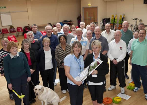 Staff and clients at Retford Leisure Centre present Jane McGowan with a Guardian Rose