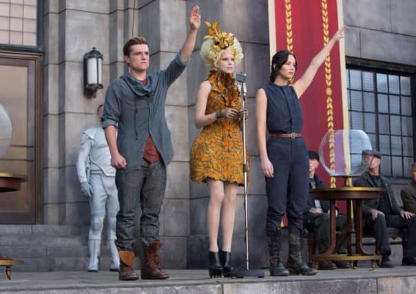 Elizabeth Banks, Josh Hutcherson and Jennifer Lawrence in The Hunger Games: Catching Fire.
