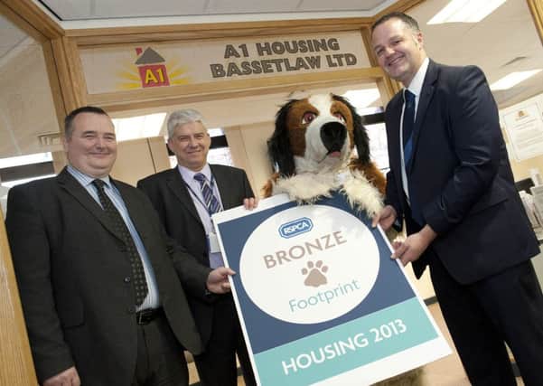 Bernard Coleman, managing director A1 Housing, Peter Exley, Tenancy and Estate Manager, Rover and Alan Chambers, Portfolio Holder for Housing with the RSPCA 'Footprint' Award