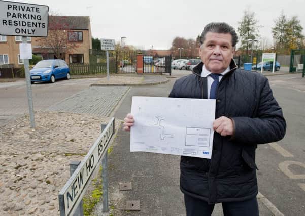 Cllr Kevin Greaves outlines the plans drawn up by Nottinghamshire country Council to introduce new parking measures outside the Priory CofE Primary School in Holles Street, Worksop to ease the traffic problems