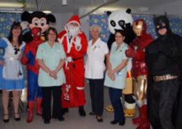 Childrens ward staff with some special Christmas visitors