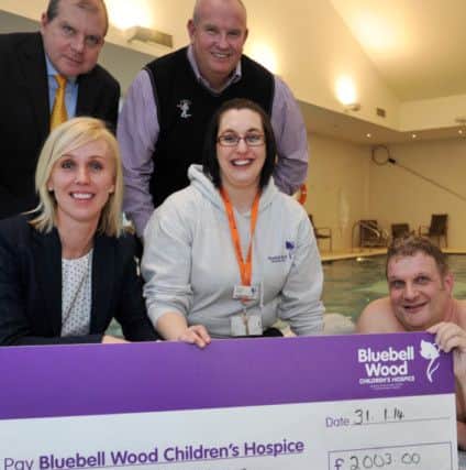 Staff and members at Clumber Park Hotel and Spa have taken part in a sponsored swim covering the distance of the English Channel in aid of Bluebell Wood Children's Hospice, pictured front left are sales manager Rachel Beer, Bluebell Wood fundraiser Emma Vizor, Bill Spencer, back from left general manager Michael Burn and Paul Gibson who swan 2,950 lengths (NWGU-31-01-14 RA 2b)