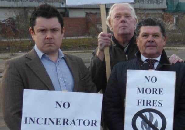 Notts County councillor Kevin Greaves (right), Bassetlaw Council leader Coun Simon Greaves (left) and a local resident show their opposition to the proposed incinerator planned for Shireoaks Road in Worksop
