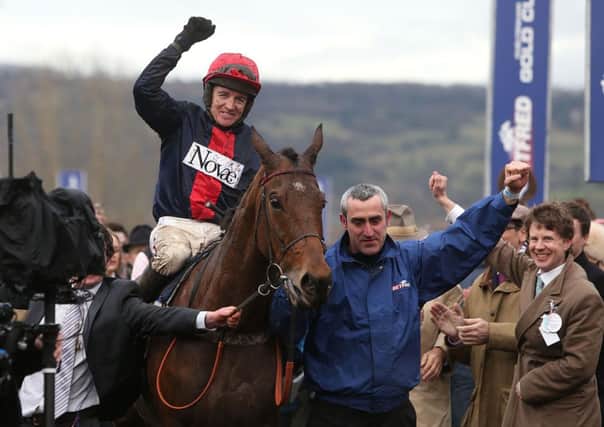 PURE GOLD -- jockey Barry Geraghty celebrates after last season's Cheltenham Gold Cup triumph by Bobs Worth (PHOTO BY: David Davies/PA Wire)