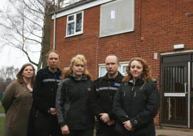 Members of Bassetlaw Council and Notts Police outside the flat