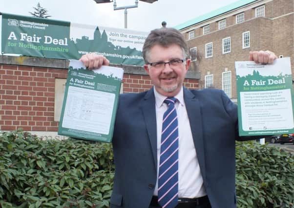 Coun Alan Rhodes, leader of Notts County Council with some of the Fair Deal petitions