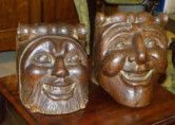 This unique pair of continental life-sized carved oak character faces were stolen from Hemswell Antiques Centre