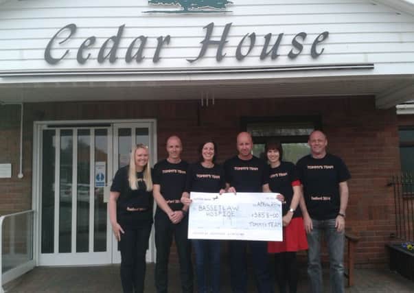 'Tommy's Team' with the £3,858 cheque for Bassetlaw Hospice