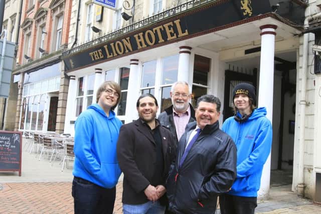 Students Jordan Robins (left) and Matthew Butcher (right) are joined by David Davies, North Notts College art and design lecturer, Bill Barker, chairman of Worksop Civic Society and County Councillor Kevin Greaves outside the Lion Hotel where one of the proposed sculptures will be sited