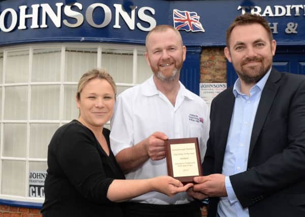 Gainsborough Standard editor Ben Green presents Rob and Teresa Johnson, with their best chip shop award. Picture: Marie Caley NGAS Chippy MC 2