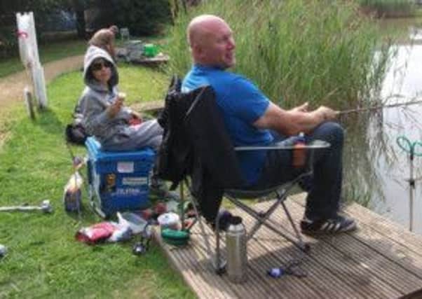 Ethan is pictured with his dad, Darren, on a fishing trip