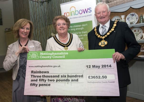 Outgoing Notts County Council chairman presented a cheque to his chosen charity Rainbows. Pictured with Coun allin are Caroline Rossin (left), area fund-raiser at Rainbows and chairman's lady, Mavis Allin
