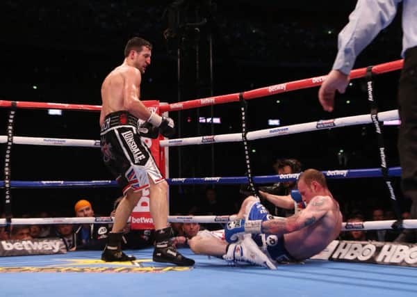 Carl Froch knocks down George Groves to win the IBF and WBA World Super Middleweight Title fight at Wembley Stadium, London. PRESS ASSOCIATION Photo. Picture date: Saturday May 31, 2014. See PA story BOXING London. Photo credit should read: Peter Byrne/PA Wire
