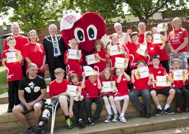Pupils at Woodsetts Primary School held a 999 Day on Monday and demonstrated to emergency services the skills they have learnt as part of the British Heart Foundation initiative. The Mayor and Mayoress of Rotherham Councillor John and Kath Foden presented certificates to the volunteers