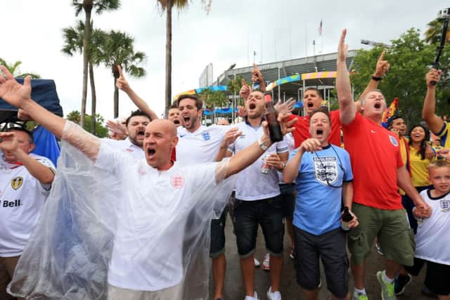 England fans brave the rain before the Friendly at the Sun Life Stadium in Miami, USA. PRESS ASSOCIATION Photo. Picture date: Wednesday June 4, 2014. See PA story SOCCER England. Photo credit should read: Mike Egerton/PA Wire. RESTRICTIONS: Use subject to FA restrictions. Editorial use only. Commercial use only with prior written consent of the FA. No editing except cropping. Call +44 (0)1158 447447 or see www.paphotos.com/info/ for full restrictions and further information.