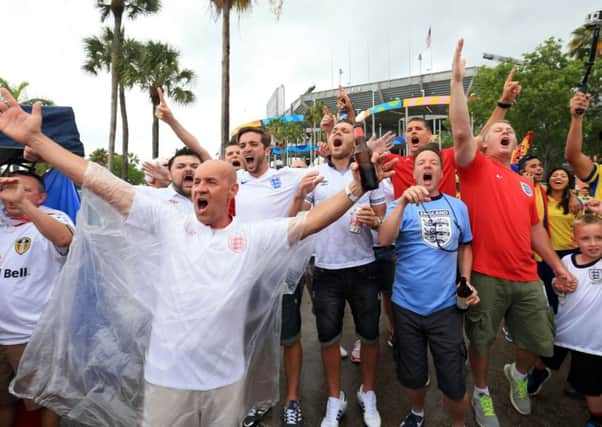 England fans brave the rain before the Friendly at the Sun Life Stadium in Miami, USA. PRESS ASSOCIATION Photo. Picture date: Wednesday June 4, 2014. See PA story SOCCER England. Photo credit should read: Mike Egerton/PA Wire. RESTRICTIONS: Use subject to FA restrictions. Editorial use only. Commercial use only with prior written consent of the FA. No editing except cropping. Call +44 (0)1158 447447 or see www.paphotos.com/info/ for full restrictions and further information.