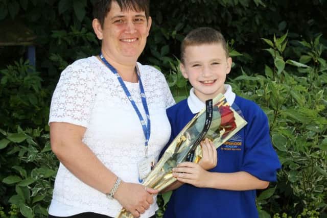 Joe Adams from Norbridge Academy in Worksop presents the Guardian Rose to Sara Williams