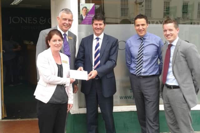 Helen Eshelby and Ian Hall from Bassetlaw Hospice receive a cheque from Matt Sharpe, Charles Daysh and Steve Dunn from Jones & Co solicitors