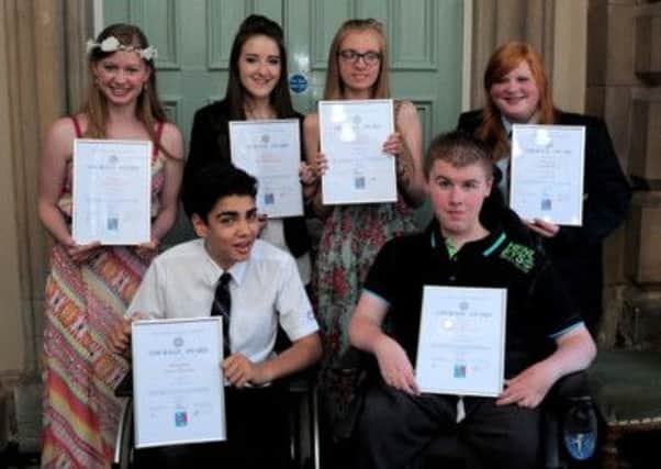 Proud winners with their certificates
