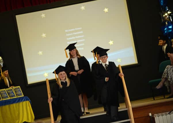 Year six pupils at Thurcroft Junior Academy enter the hall for their school graduation. Picture: Marie Caley