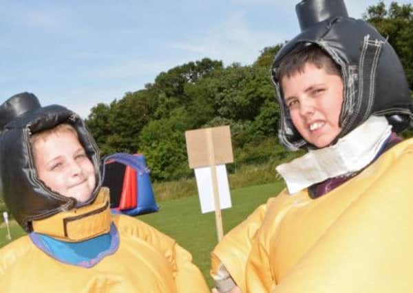 Reece Smith, 13 and Lewis Tinker, 12, both of Discover House, pictured taking part in the Sumo Wrestling. Picture: Marie Caley NGAS Challenge MC 2
