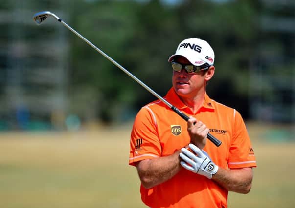 Lee Westwood battled his way to an opening round of 71 at The Open