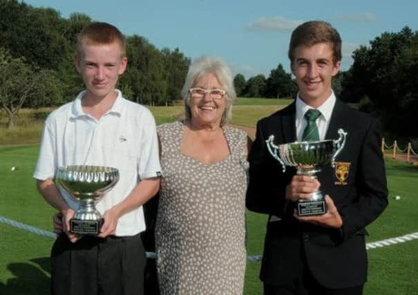 Trish Westwood with the winners at the Lee Westwood Junior Golf Championship, Reece Samson (scratch competition, right) and  Keane Barson (handicap competition). Picture: Barrie Codling