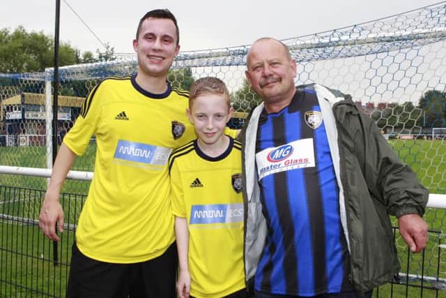 Tigers supporters club chairman Kev Keep (right) joins Dean Spencer and Luke Pickersgill (11) after they ran five miles from Carlton-in-Lindrick to raise more than £700 for the club. Picture: Richard Parkes