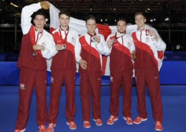 Sam Walker (second left) celebrates with his England team-mates after winning silver at the Commonwealth Games