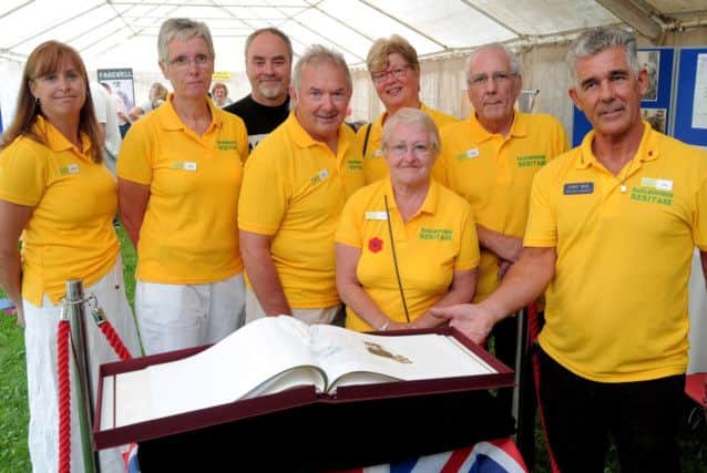 NWGU 2-8-14 Barlborough Heroes, Tony Bak, Heritage centre Manager (right) with Book of Remembrance of 45 who died in WW1 out of 225 who served.
With him are L/R; John Tipper, Norma Machin, Helen Slonskyj, Neil Hartburn,
Nick Slonskyj, Linda Jackson, Annett Humphreys. BC 4