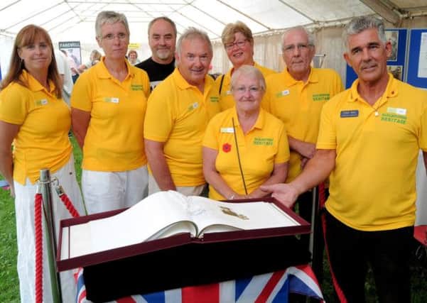 NWGU 2-8-14 Barlborough Heroes, Tony Bak, Heritage centre Manager (right) with Book of Remembrance of 45 who died in WW1 out of 225 who served.
With him are L/R; John Tipper, Norma Machin, Helen Slonskyj, Neil Hartburn,
Nick Slonskyj, Linda Jackson, Annett Humphreys.  BC  4