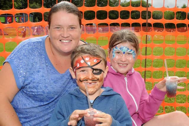 (l-r) Kelly, Adam, six, and Chloe Fitch, 10, of Costhorpe at the Langold Country Park family fun day. Picture: Andrew Roe