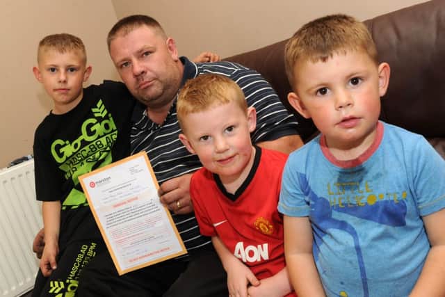 Martin Rhodes with his children. Picture: Andrew Roe