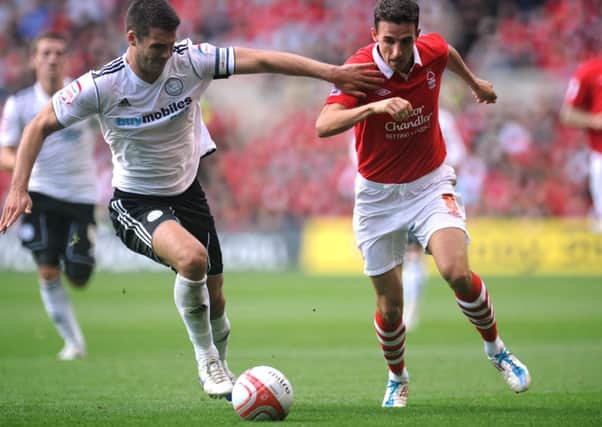 Nottingham Forest's Matt Derbyshire (right) and Derby County's Jason Shackell in action during the npower Football League Championship match at the City Ground.