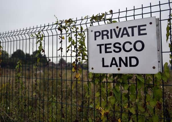 Site of the new Tesco store between Carlton Road and Blyth Road overgrown with weeds