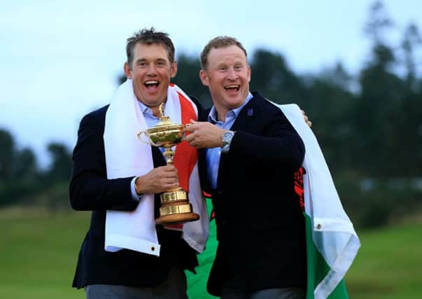 Europe's Lee Westwood (left) and Jamie Donaldson pose with The Ryder Cup on day three of the 40th Ryder Cup at Gleneagles