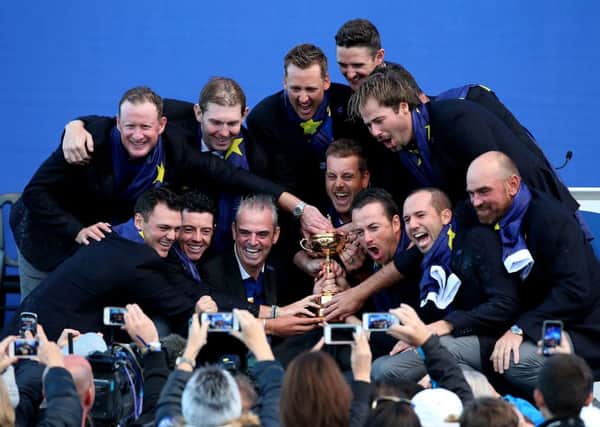 Europe celebrate with the Ryder Cup during the presentations on day three of the 40th Ryder Cup at Gleneagles Golf Course, Perthshire.