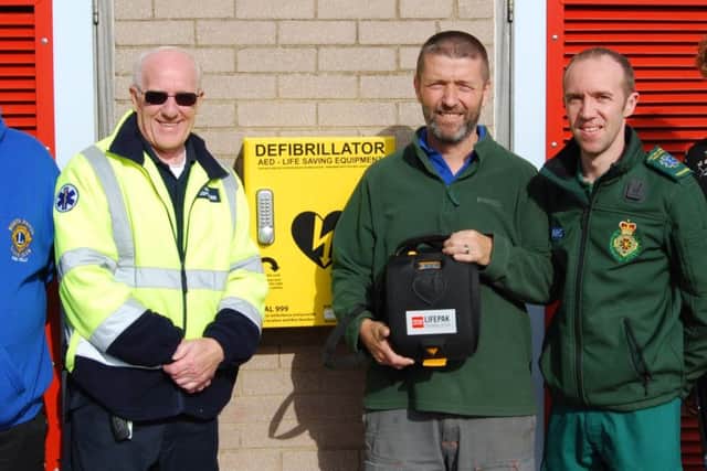 Those involved at the Misterton Swimming Pool with the AED and cabinet.