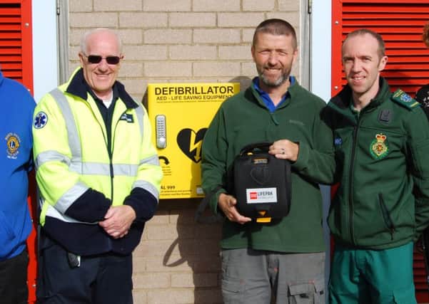 Those involved at the Misterton Swimming Pool with the AED and cabinet.