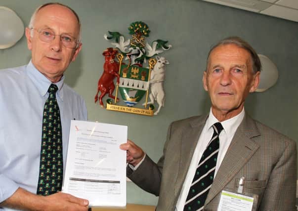 Gordon Allen presented a petition to Coun Jeff Summers, leader of West Lindsey District Council protesting about the urbanisation of Saxilby and surrounding areas.