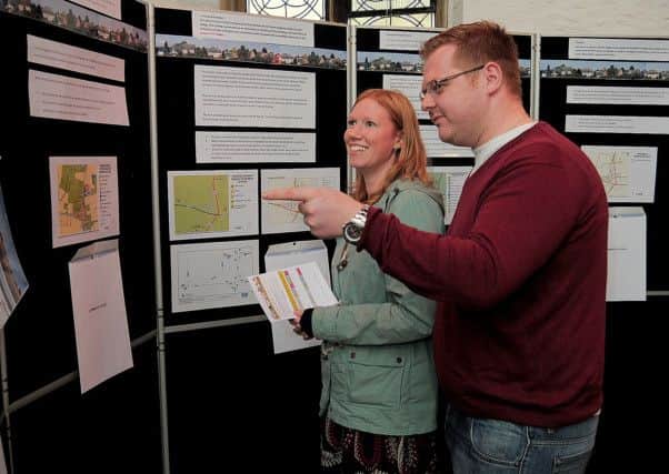 Villagers attending a  'Village Plan', Consultation at Newton on Trent, Lincolnshire.Charles & Michelle Nicholls, Newton villagers, looking at the Village Plan proposals