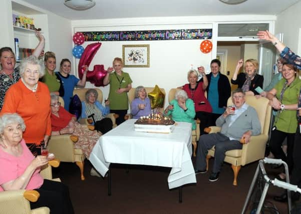 Residents and staff at the Woodlands Care Home in North Anston raise a glass to their 4th anniversary during a Bonfire night celebration.
