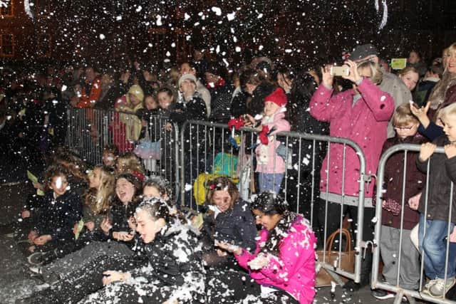 Worksop Christmas lights switch-on 2014. The lights are turned on and snow falls from the sky.