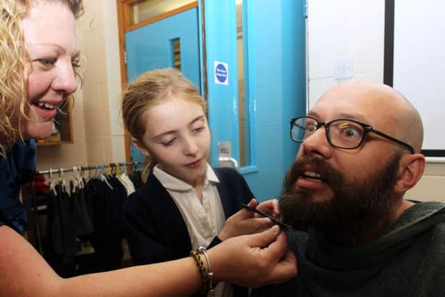 Ben Stockdale from Corringham Primary School had his beard shaved for charity. Pupil at the school Tia Walford, seven, made the first cut.