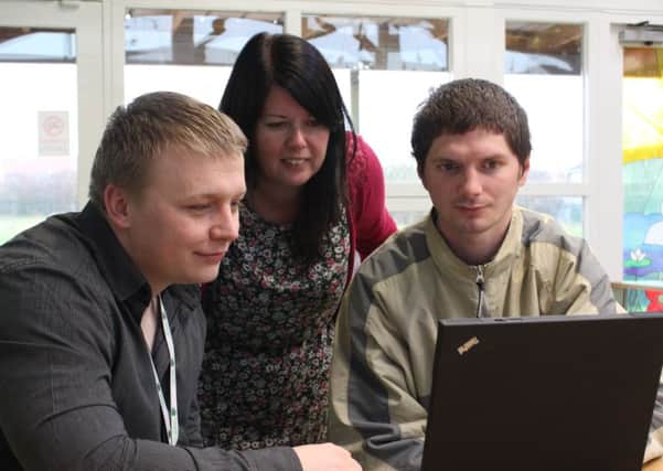 WLDC digital champion Luke Russell and Claire White, early years manager at GAPA help jobseeker Sean OMara online