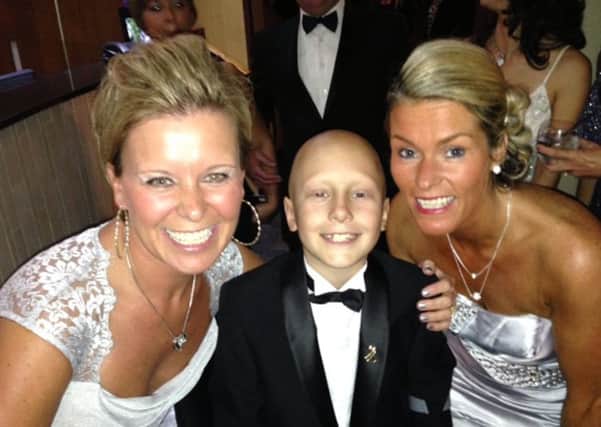 Ethan is pictured with his godmother, Dawn Foulston and his mum, Sam Maull