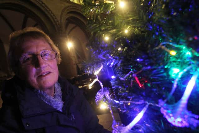 Christmas Tree Festival at Priory Church in Worksop. Pictured is Barbara Trigg with The Stepping Stones Drop In Centre tree.