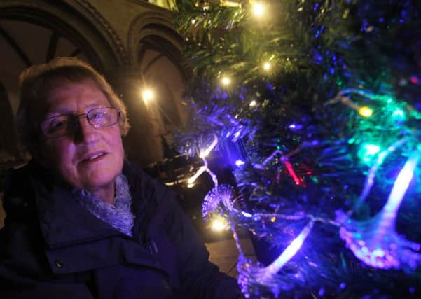 Christmas Tree Festival at Priory Church in Worksop. Pictured is Barbara Trigg with The Stepping Stones Drop In Centre tree.
